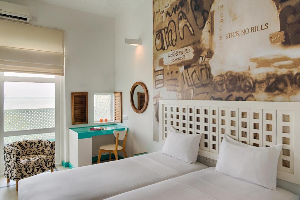 Postel nebo postele na pokoji v ubytování Hotel J Negombo