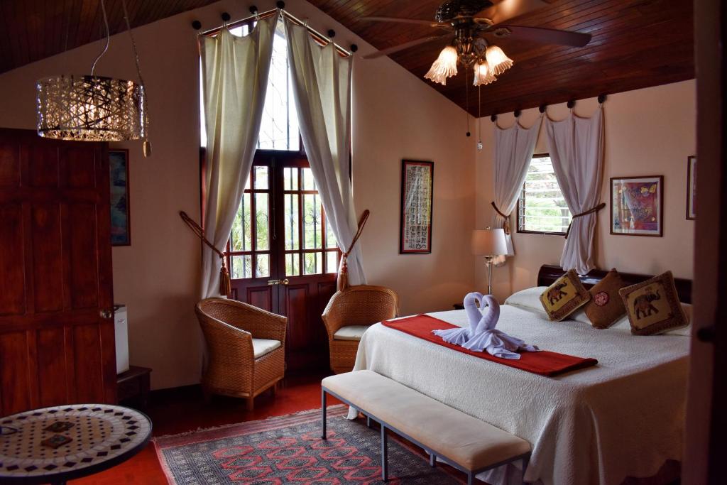 Postel nebo postele na pokoji v ubytování Cariari Bed & Breakfast