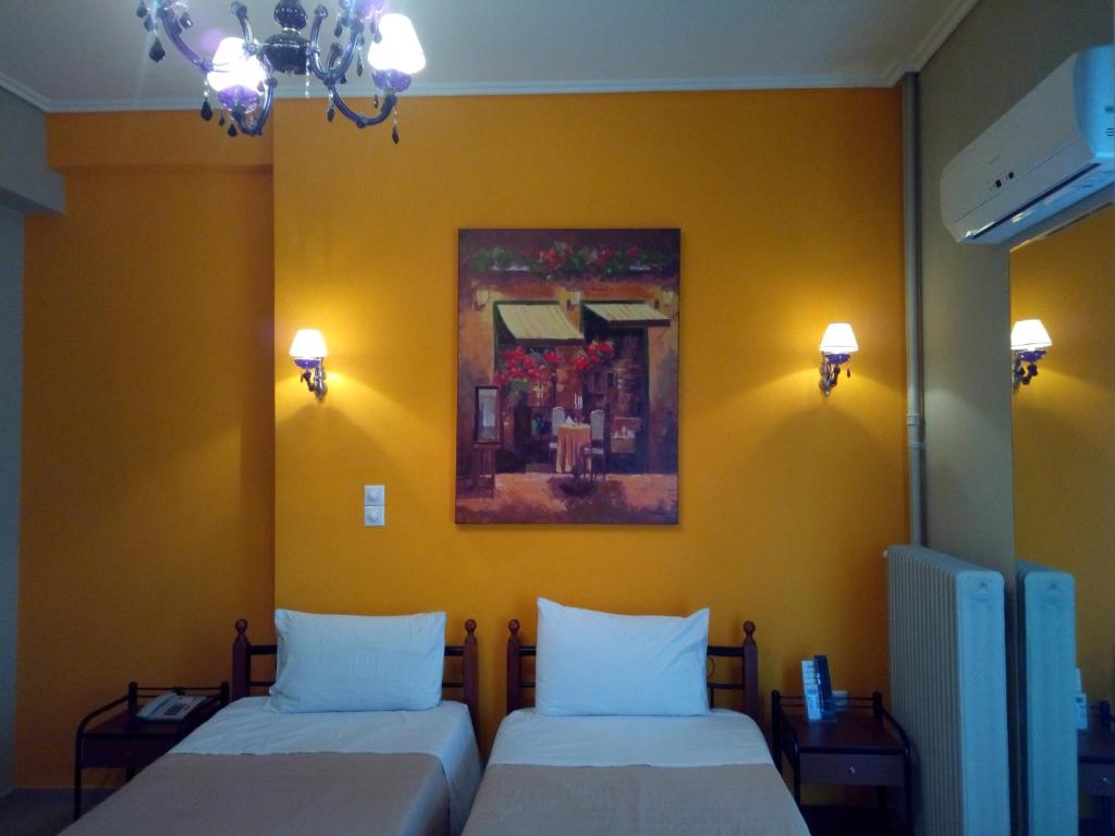Posteľ alebo postele v izbe v ubytovaní Zappion Hotel