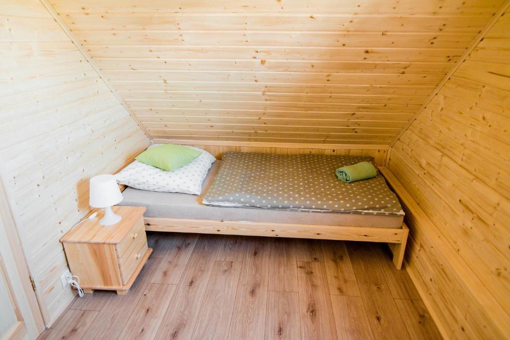 Postel nebo postele na pokoji v ubytování Ustecka Osada - Ustka (Przewłoka)