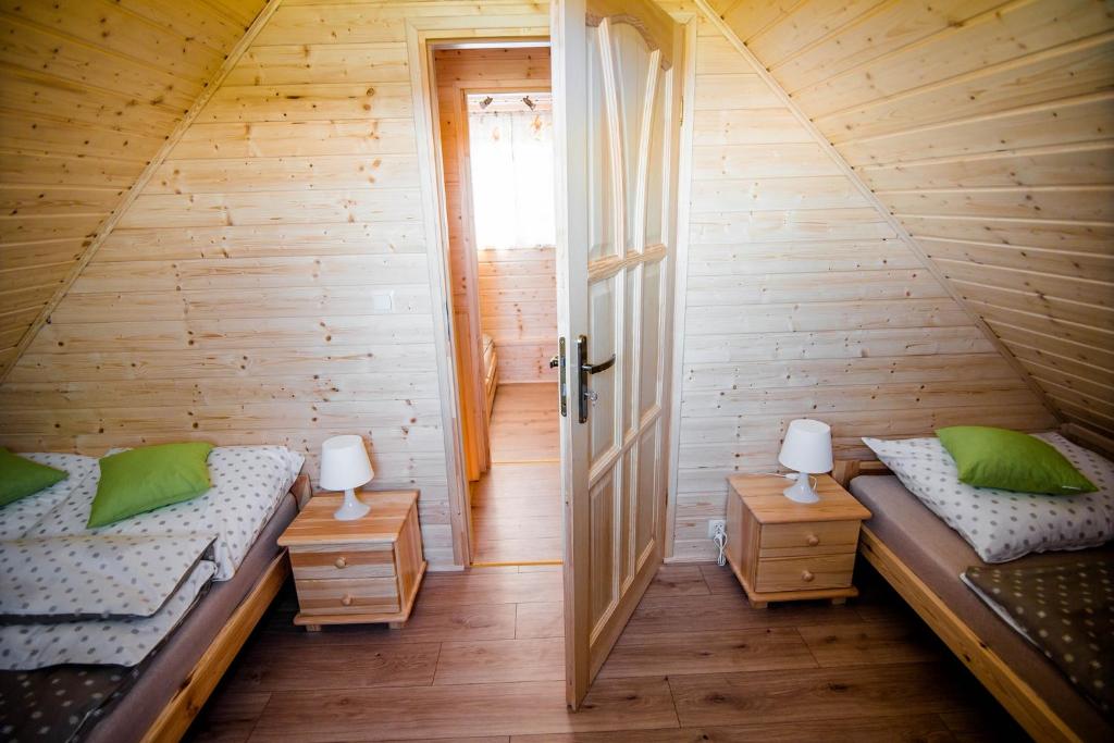 Postel nebo postele na pokoji v ubytování Ustecka Osada - Ustka (Przewłoka)