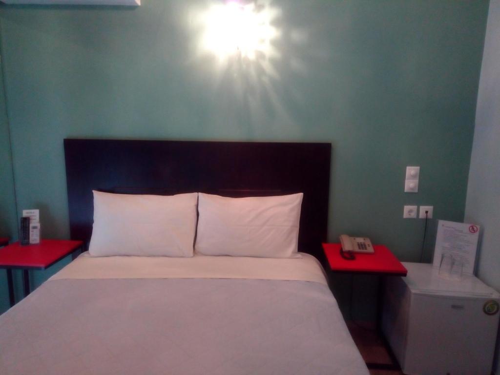 Posteľ alebo postele v izbe v ubytovaní Zappion Hotel