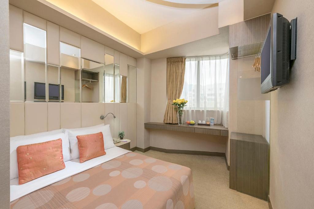 Televiisor ja/või meelelahutuskeskus majutusasutuses Silka Seaview Hotel
