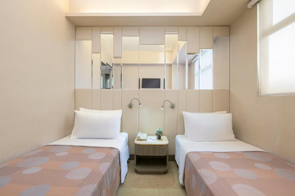 Voodi või voodid majutusasutuse Silka Seaview Hotel toas