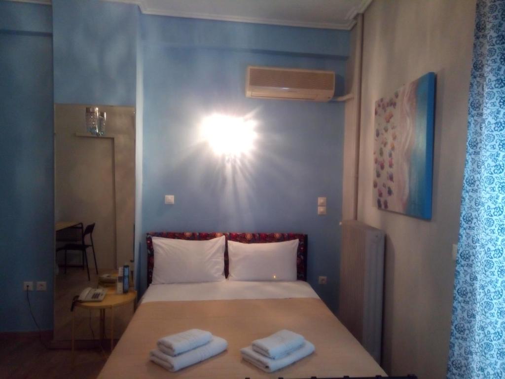 Posteľ alebo postele v izbe v ubytovaní Zappion Hotel