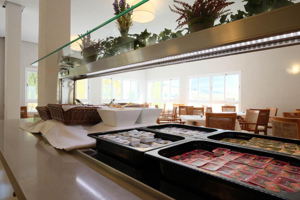 Kuchyň nebo kuchyňský kout v ubytování azuLine Hotel Palmanova Garden