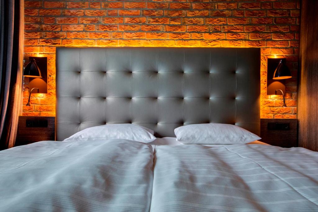 Postel nebo postele na pokoji v ubytování Park Inn by Radisson Lübeck