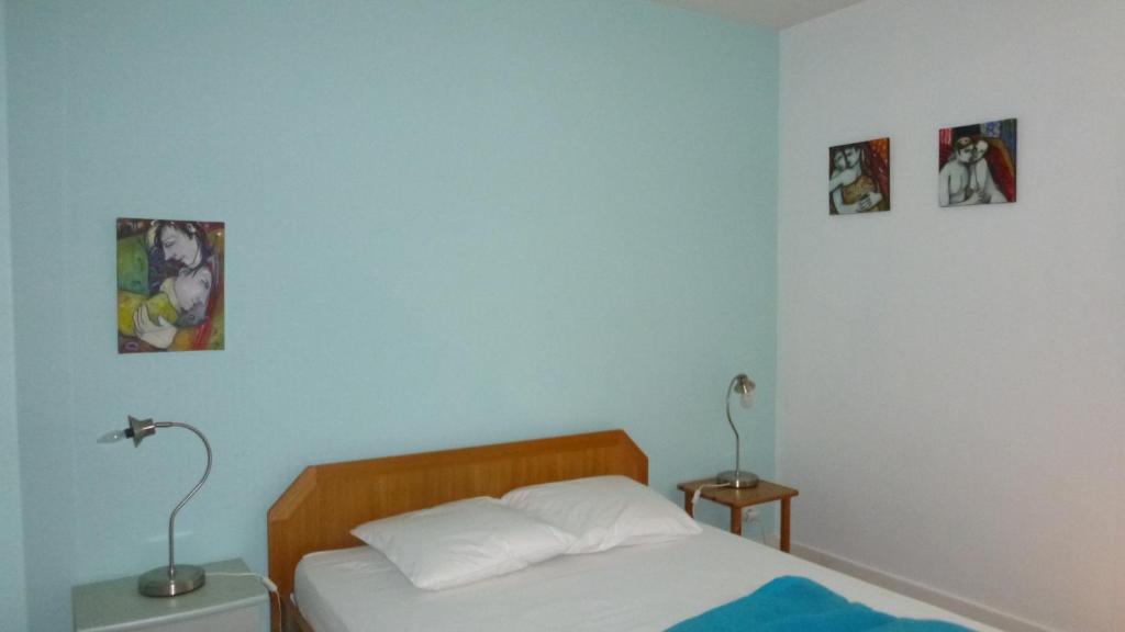 Postel nebo postele na pokoji v ubytování Ti Post