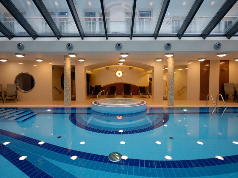 a large swimming pool in a large building at Phoenix in Kołobrzeg