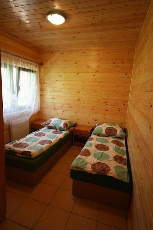 Postel nebo postele na pokoji v ubytování Łebski Kemping