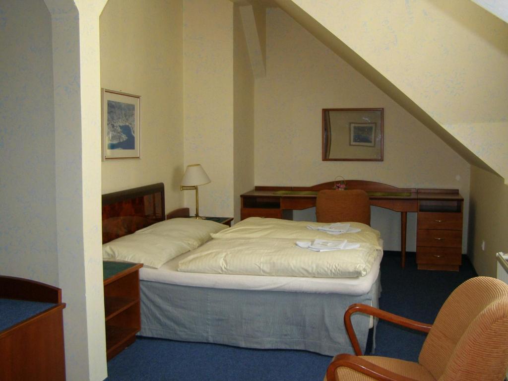 Postel nebo postele na pokoji v ubytování Hotel Goethe