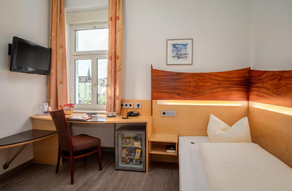 Postel nebo postele na pokoji v ubytování Hotel Spitzberg Garni
