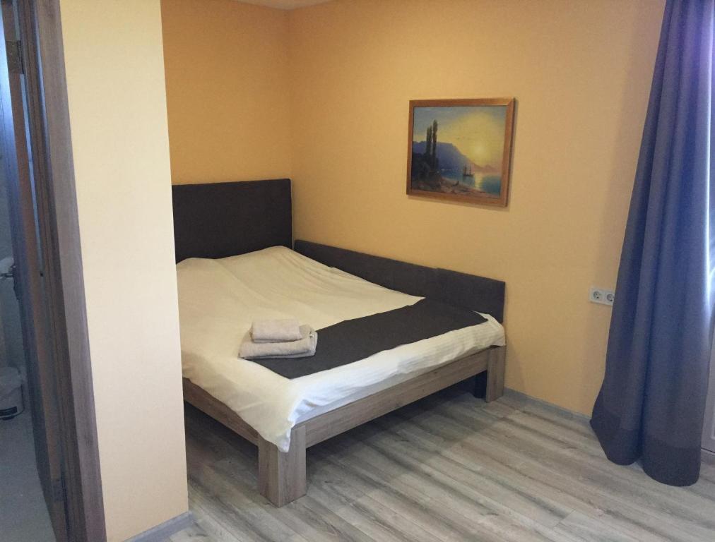 Postel nebo postele na pokoji v ubytování Vesyolaya Rochsha