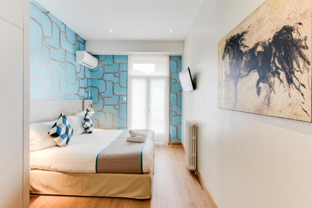 Postel nebo postele na pokoji v ubytování Hôtel Provençal