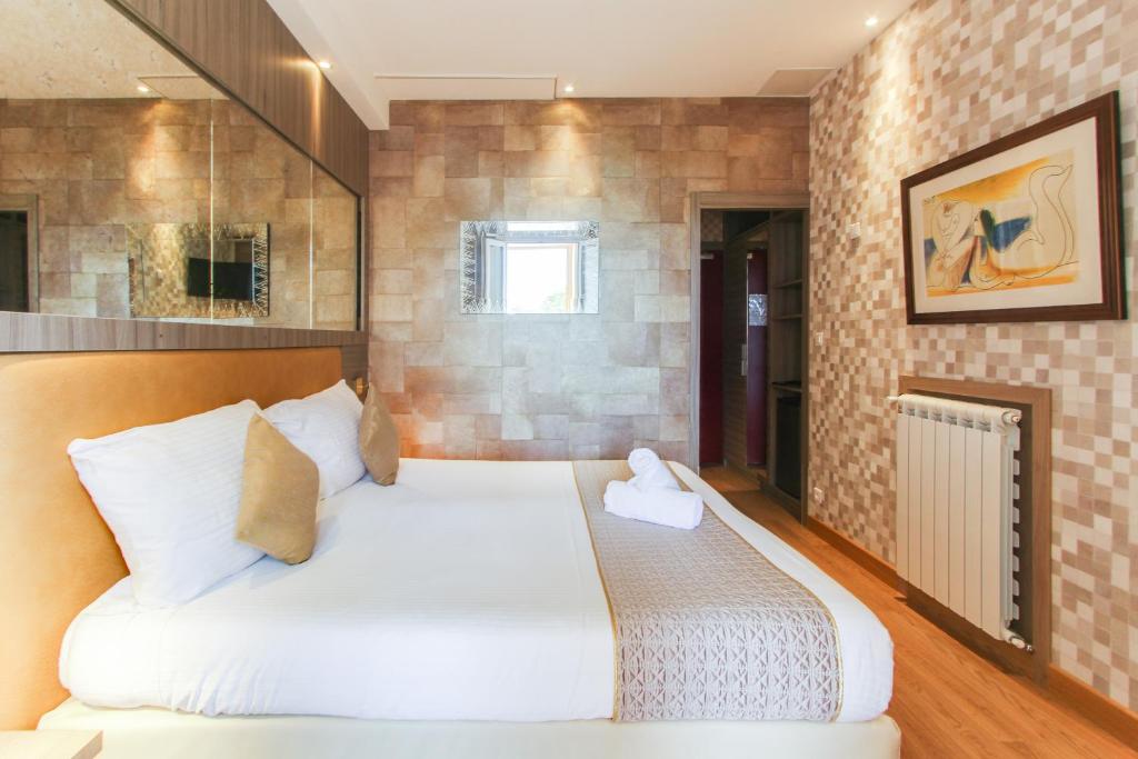 Postel nebo postele na pokoji v ubytování Hôtel Provençal