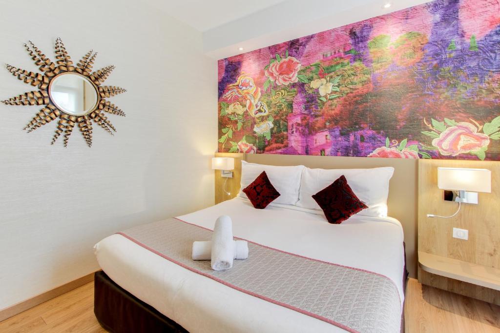 Postel nebo postele na pokoji v ubytování Hôtel Provençal