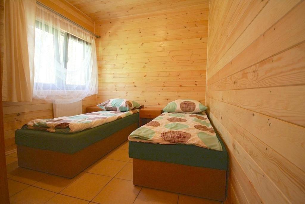 Postel nebo postele na pokoji v ubytování Łebski Kemping