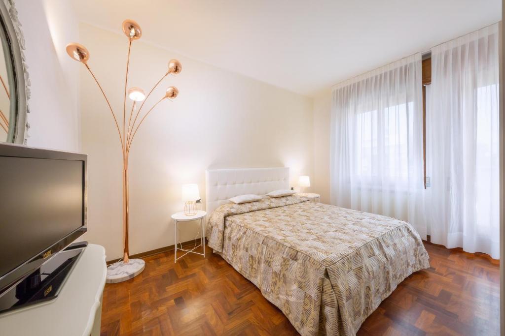 Кровать или кровати в номере Appartamenti Mare Caorle