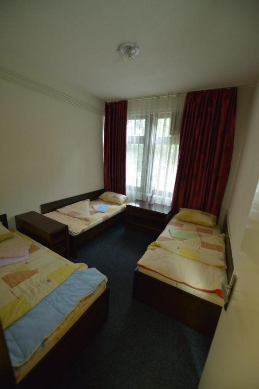 Postel nebo postele na pokoji v ubytování Guesthouse Duga