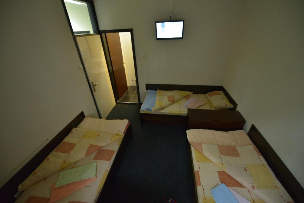 Postel nebo postele na pokoji v ubytování Guesthouse Duga