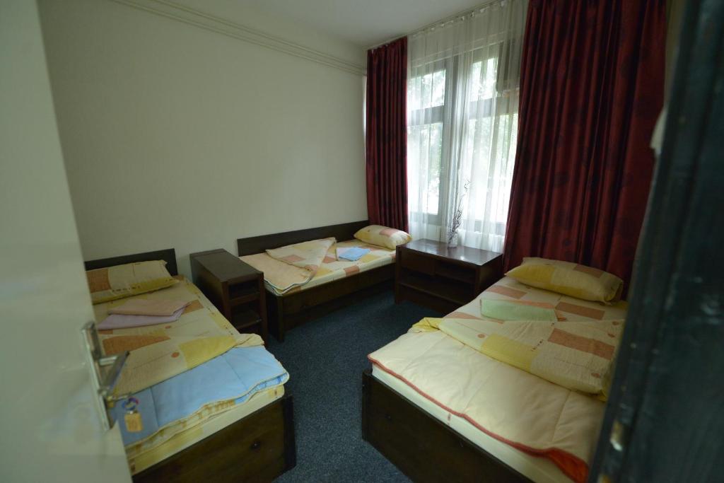 Postel nebo postele na pokoji v ubytování Guesthouse Duga