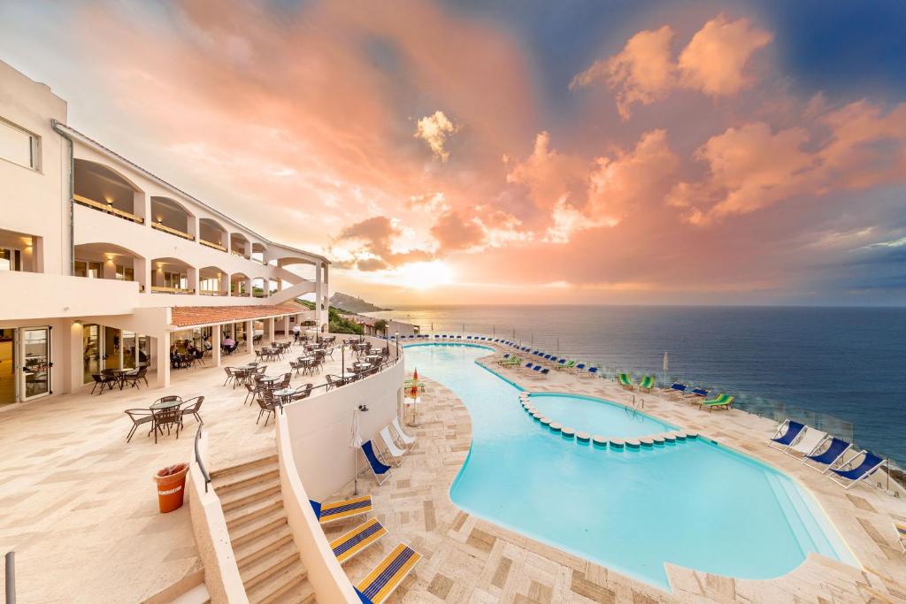 a view of the pool at the oceanfront resort at Castelsardo Resort Village in Castelsardo