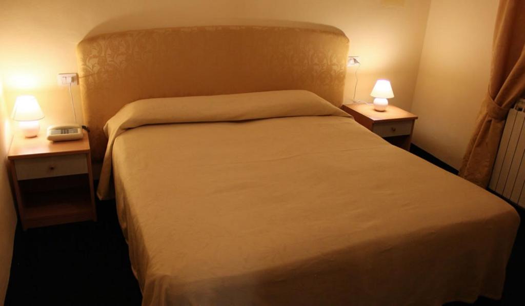 Postel nebo postele na pokoji v ubytování Hotel Romagna