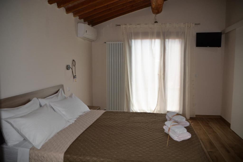 Postel nebo postele na pokoji v ubytování Agriturismo L'Aquilone