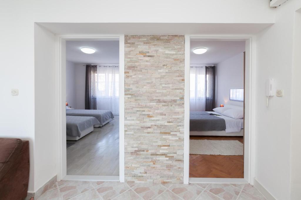 Posteľ alebo postele v izbe v ubytovaní Apartman Bordura