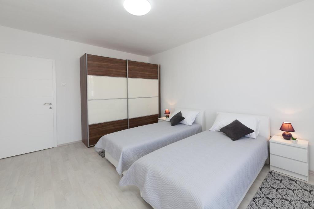 Posteľ alebo postele v izbe v ubytovaní Apartman Bordura