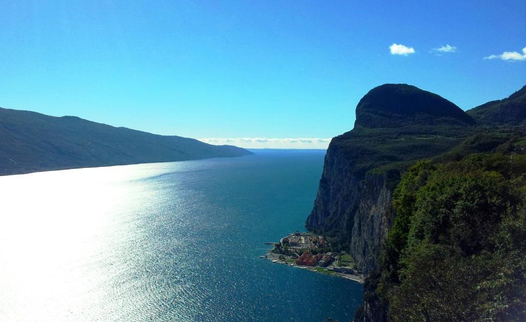 an island in the middle of a large body of water at Casa del Borgo Maria Luisa by Gardadomusmea in Tremosine Sul Garda