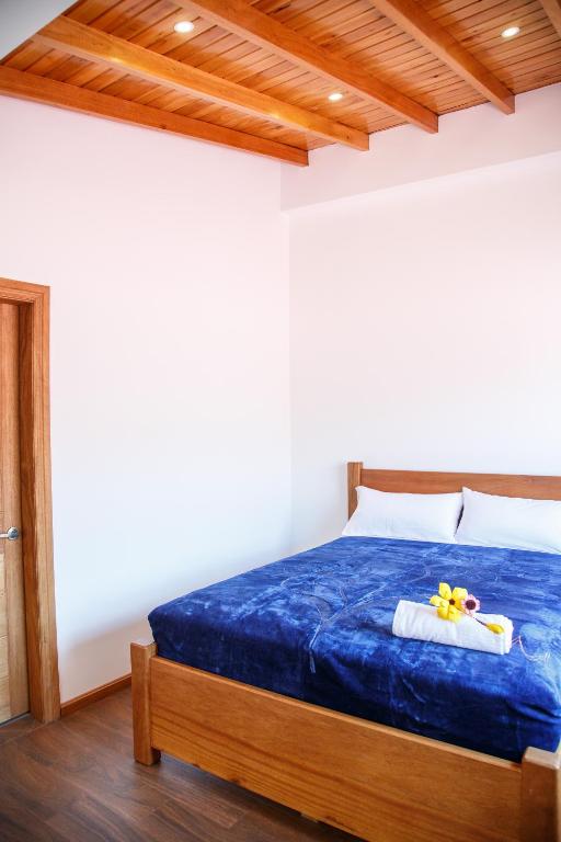 Postel nebo postele na pokoji v ubytování Community Hostel Alausi