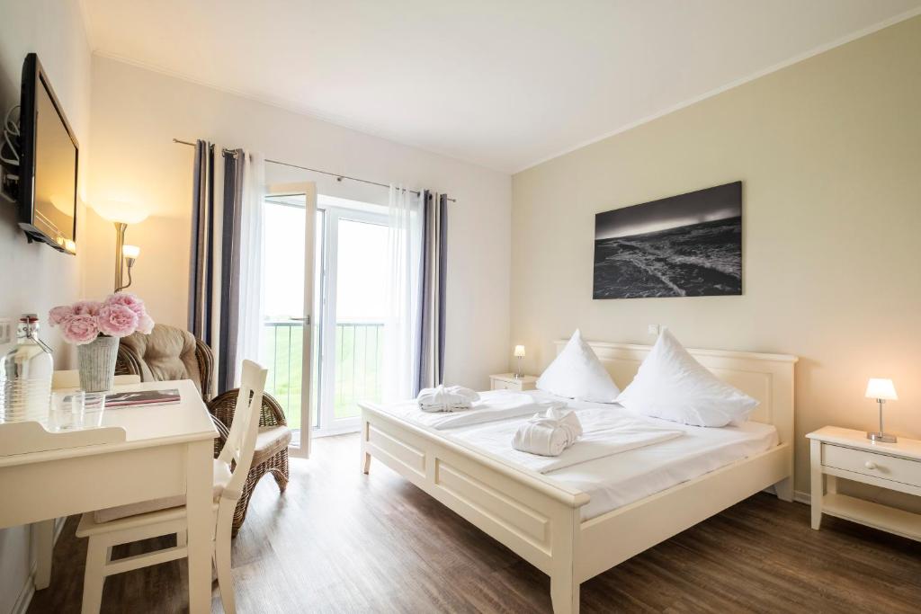 Postel nebo postele na pokoji v ubytování Hotel, Restaurant, Café Pharisäerhof - Nordseeurlaub mit Hund