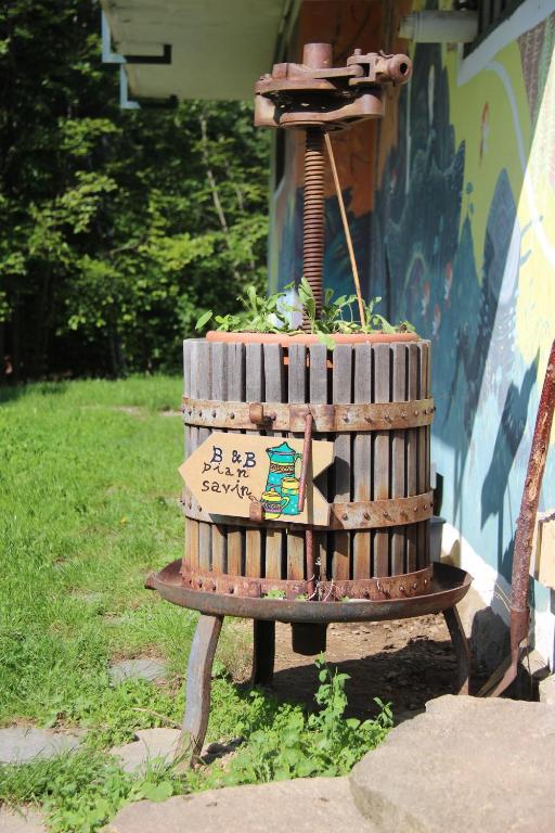 a stack of wooden barrels sitting on top of a table at B&B Pian Savin in Giaveno