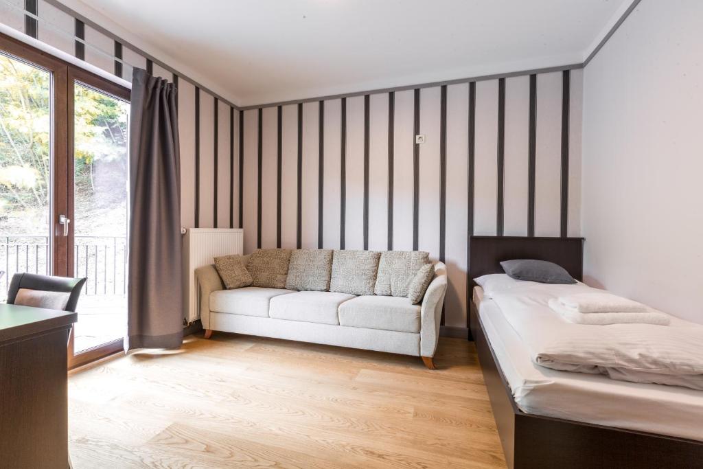Postel nebo postele na pokoji v ubytování Hotel Mandát