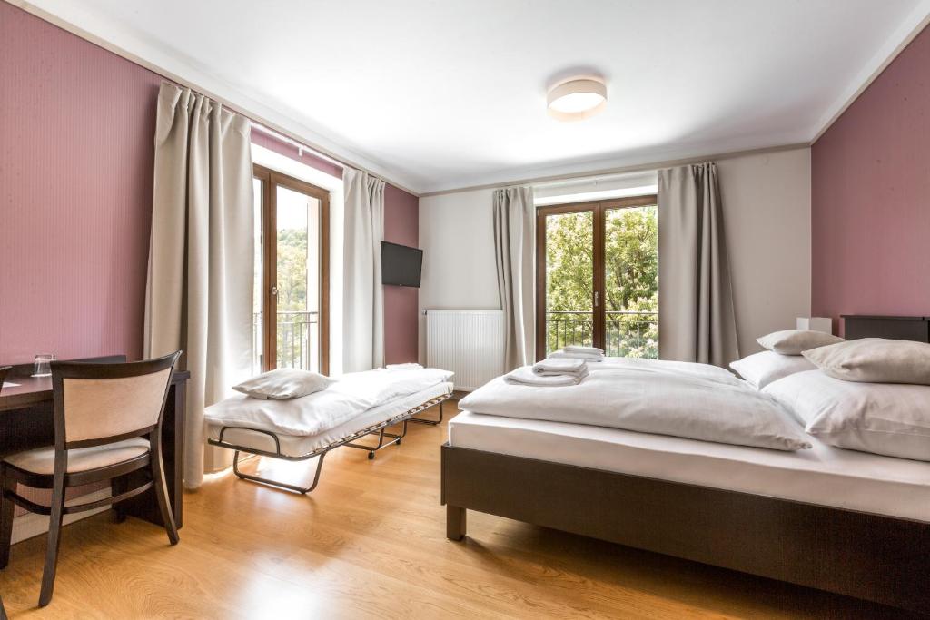 Postel nebo postele na pokoji v ubytování Hotel Mandát