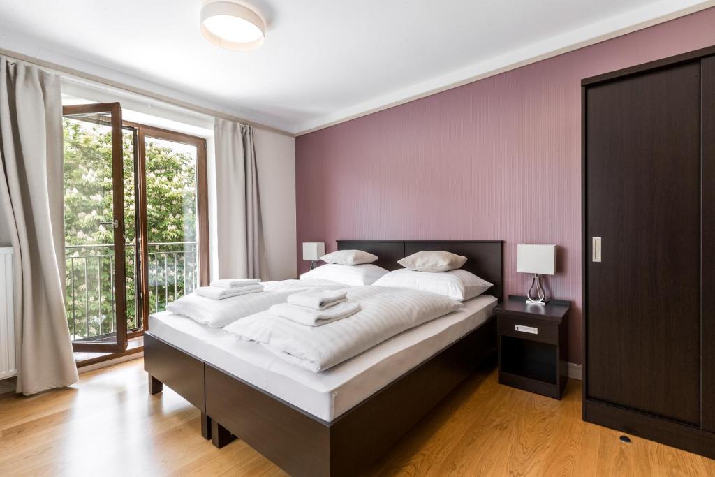 Postel nebo postele na pokoji v ubytování Hotel Mandát