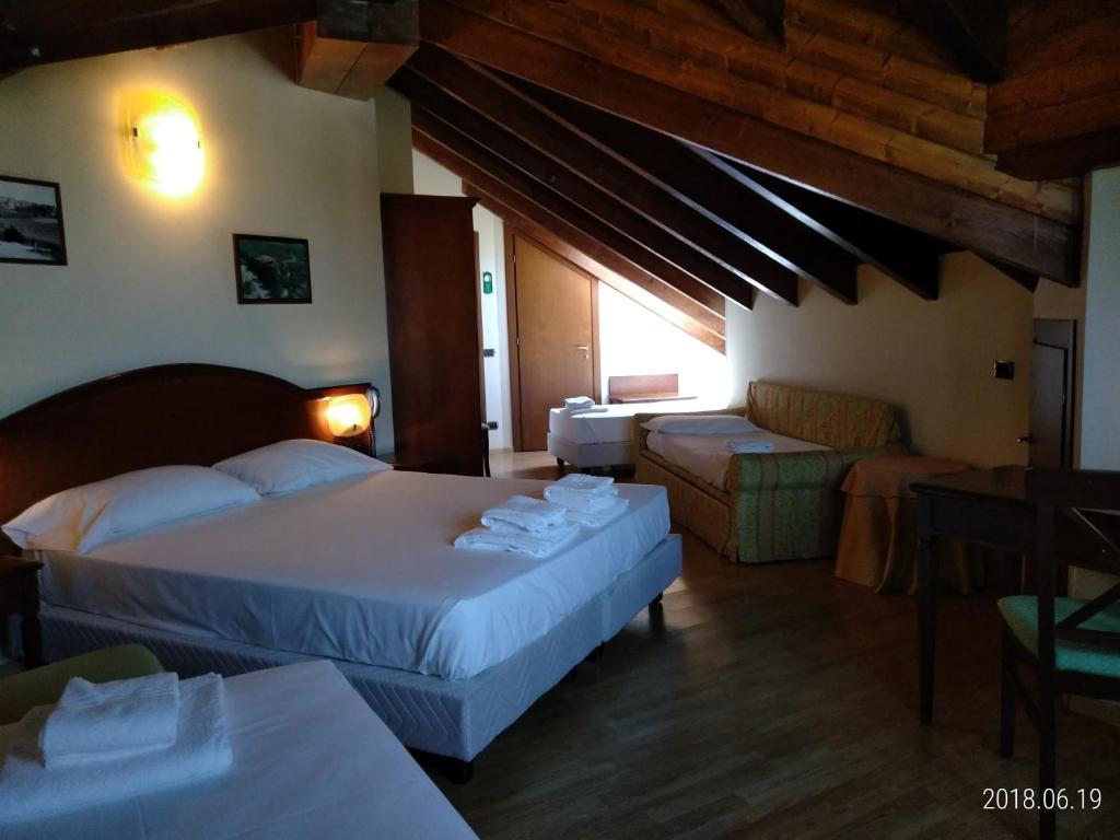 Postel nebo postele na pokoji v ubytování Hotel Belvedere