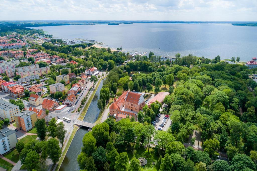 a large body of water with a bridge over it at Hotel St. Bruno in Giżycko