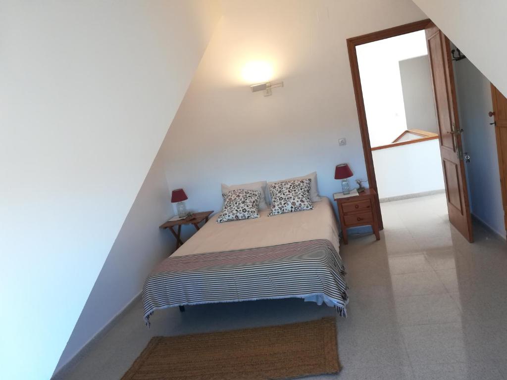 Postel nebo postele na pokoji v ubytování Casa Algaida