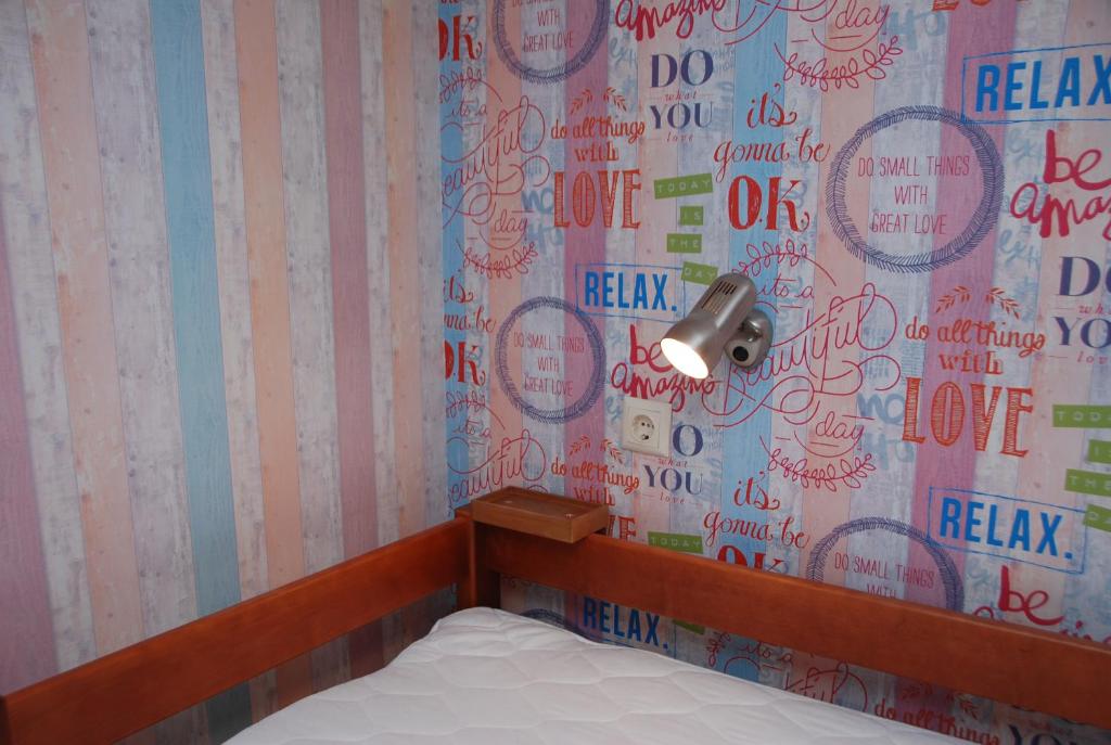 Postel nebo postele na pokoji v ubytování Green Apple Hostel