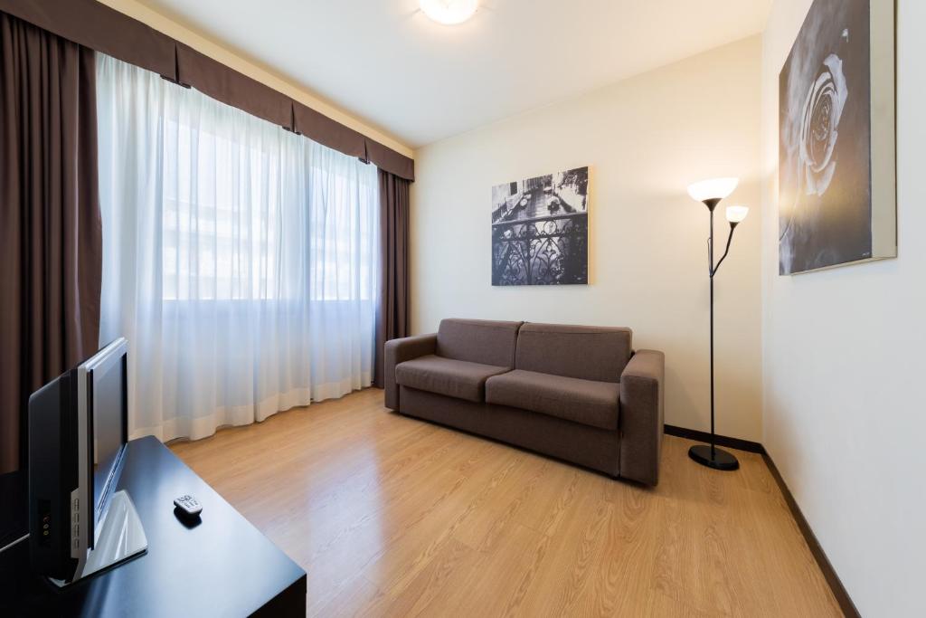 Televízia a/alebo spoločenská miestnosť v ubytovaní Hotel Delfino Venezia Mestre