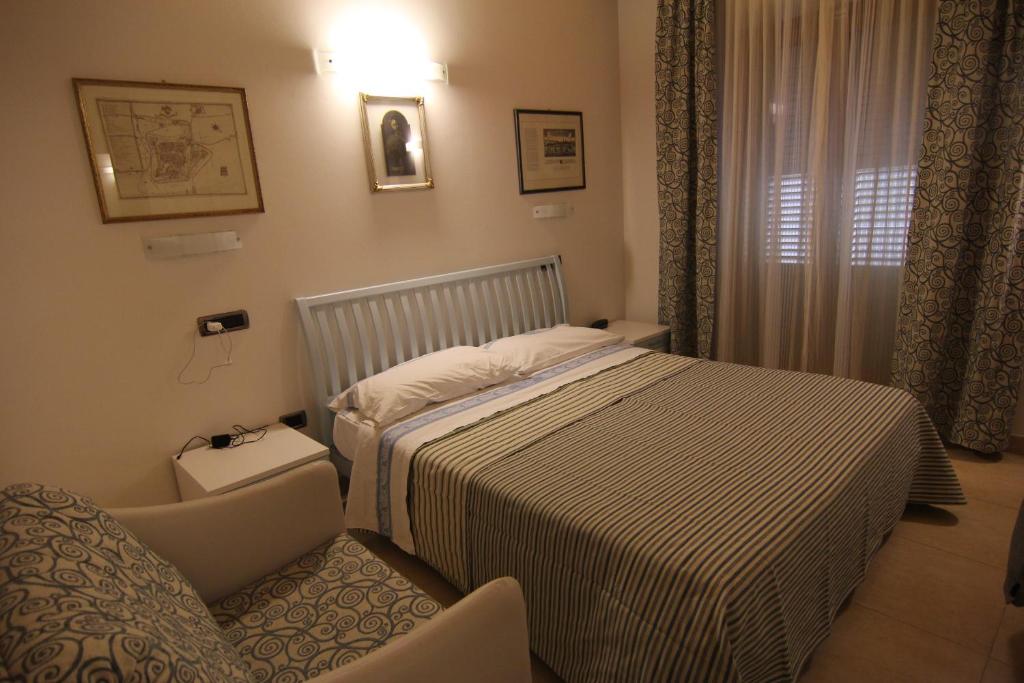 Postel nebo postele na pokoji v ubytování Albergo Bice