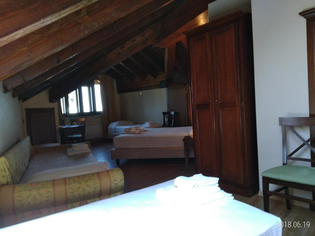 Postel nebo postele na pokoji v ubytování Hotel Belvedere