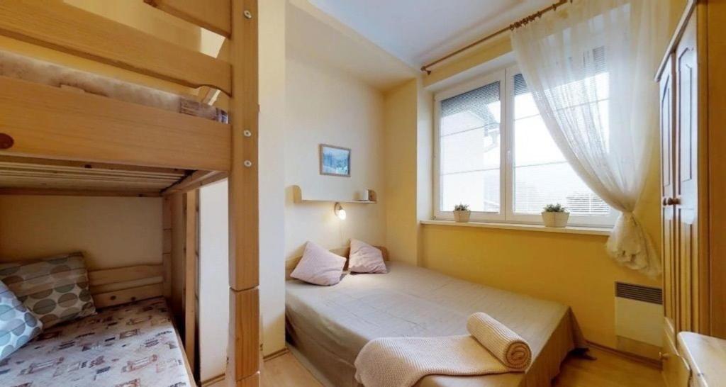 Postel nebo postele na pokoji v ubytování Apartmán Magura Donovaly