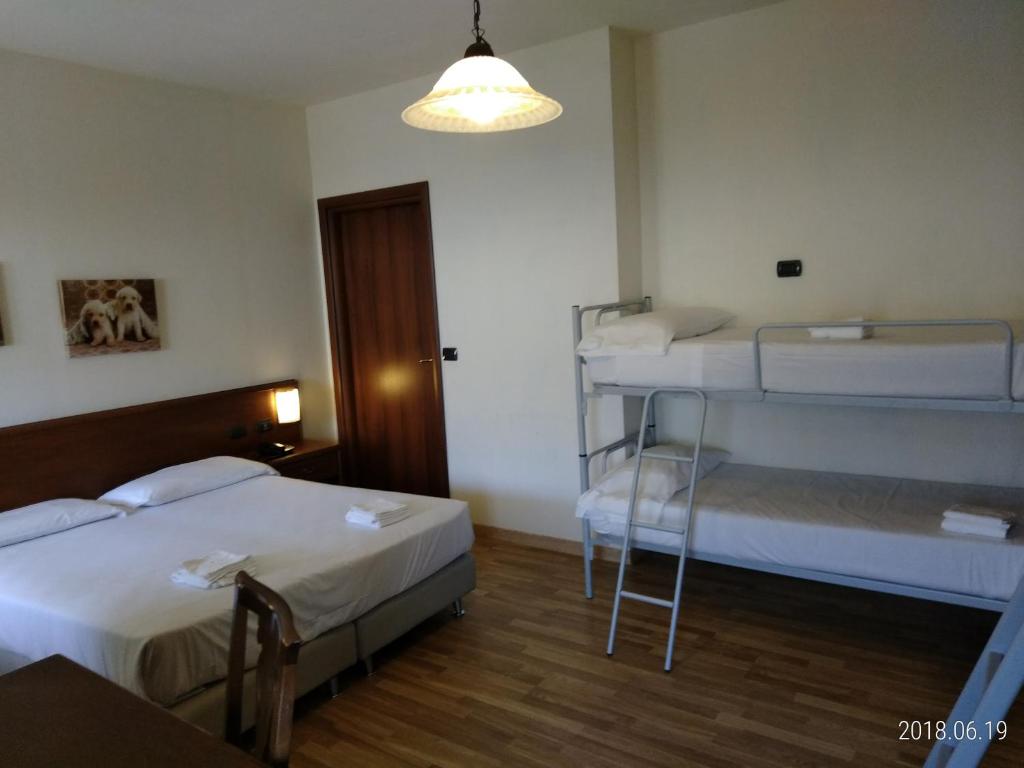 Postel nebo postele na pokoji v ubytování Hotel Belvedere
