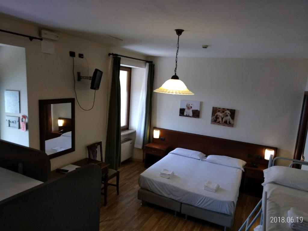 Postel nebo postele na pokoji v ubytování Hotel Belvedere