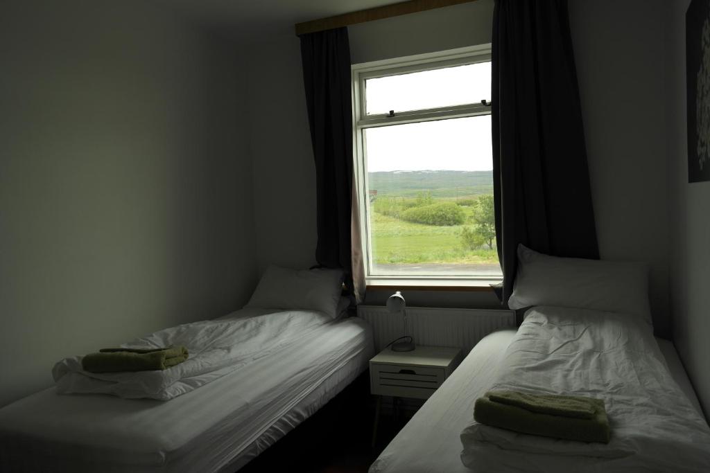 Postel nebo postele na pokoji v ubytování Eidavellir Apartments and Rooms