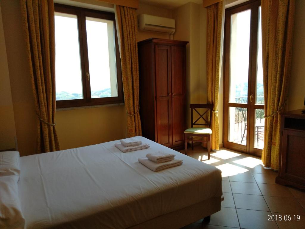 Postel nebo postele na pokoji v ubytování Hotel Belvedere