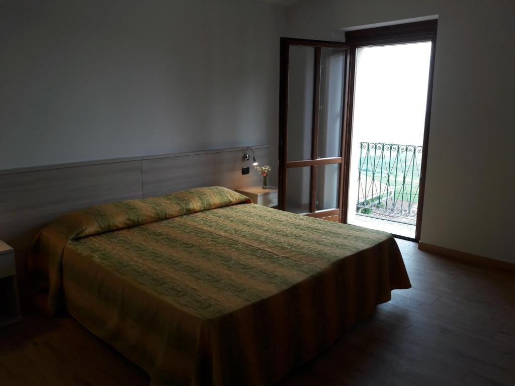 Postel nebo postele na pokoji v ubytování Albergo Diffuso Belvedere